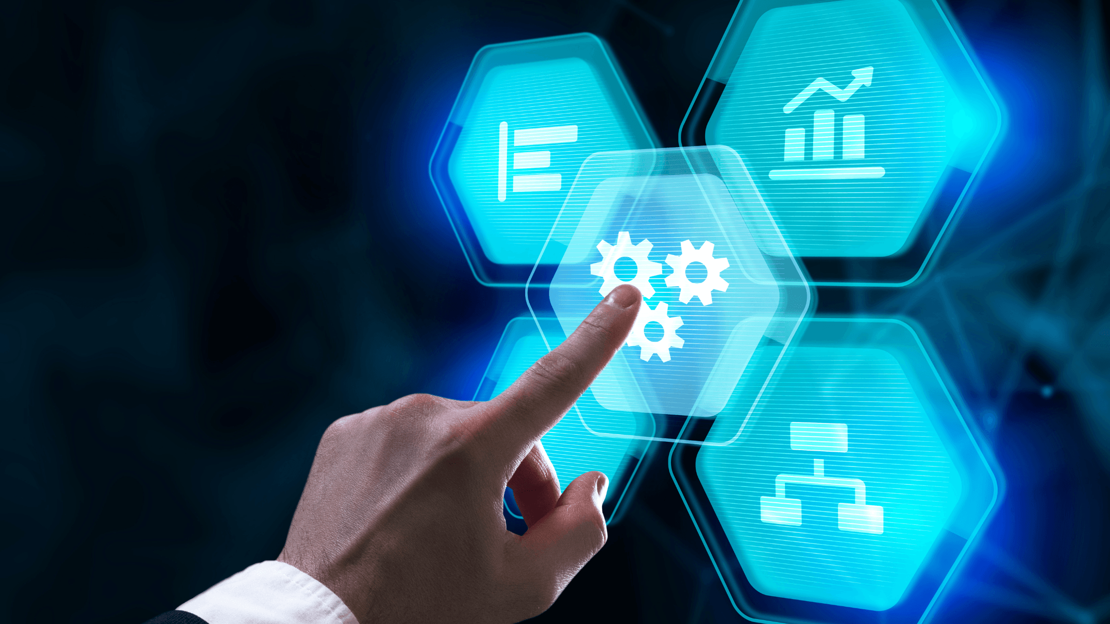 A close-up of a hand pointing toward a glowing blue hexagonal icon featuring a gear and profiles of people, surrounded by other abstract digital hexagons representing data analytics, workflows, and automation.